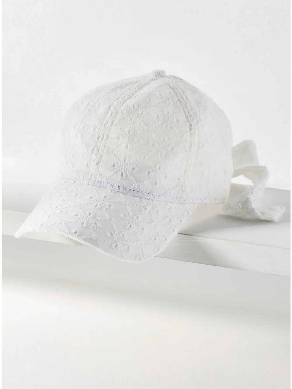 Anthropologie Eyelet Baseball Cap with Bow Back in White. One size. Brand new!